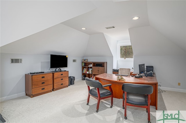 office area featuring lofted ceiling and light carpet