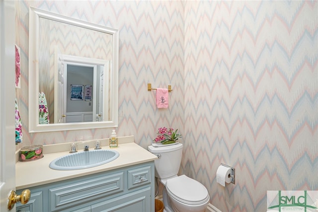 bathroom with vanity and toilet