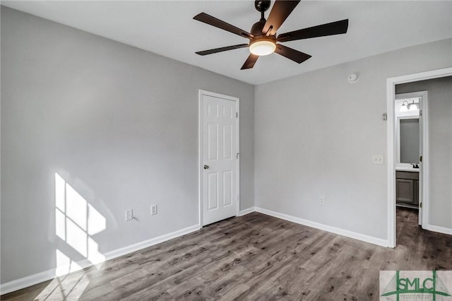 empty room with ceiling fan and hardwood / wood-style floors