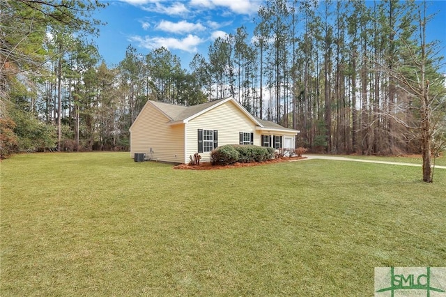 view of side of property with a yard