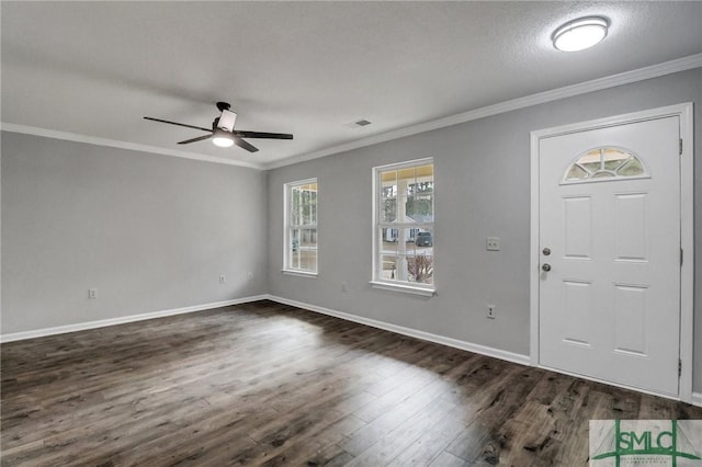 entryway with dark hardwood / wood-style flooring, a textured ceiling, ornamental molding, and ceiling fan