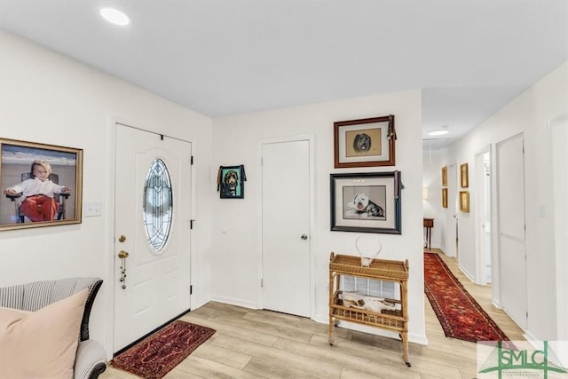 foyer entrance featuring light wood-type flooring