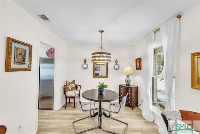 dining room with light wood-type flooring