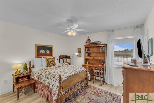 bedroom featuring light hardwood / wood-style flooring and ceiling fan