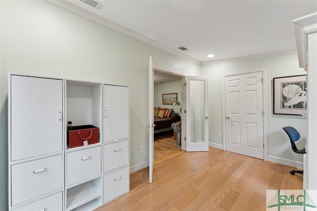 office area featuring ornamental molding and light wood-type flooring