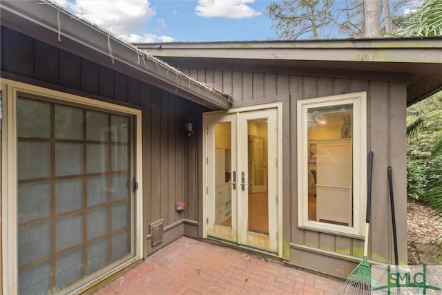 entrance to property with a patio area and french doors