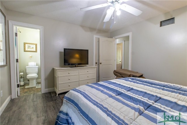 bedroom featuring ensuite bathroom, dark hardwood / wood-style floors, and ceiling fan