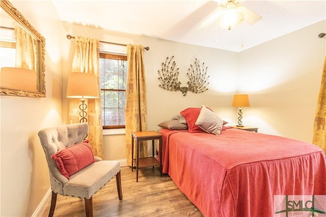 bedroom featuring ceiling fan and wood-type flooring