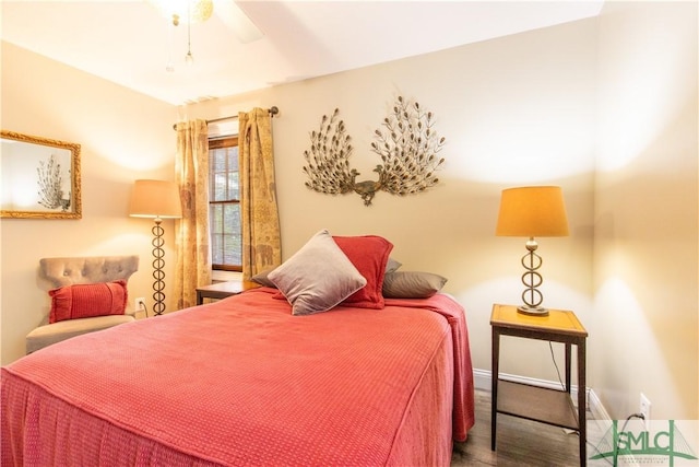 bedroom featuring hardwood / wood-style flooring and ceiling fan