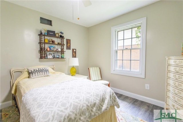 bedroom featuring dark hardwood / wood-style floors and ceiling fan