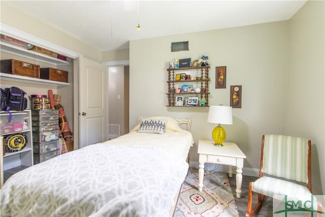 bedroom with wood-type flooring