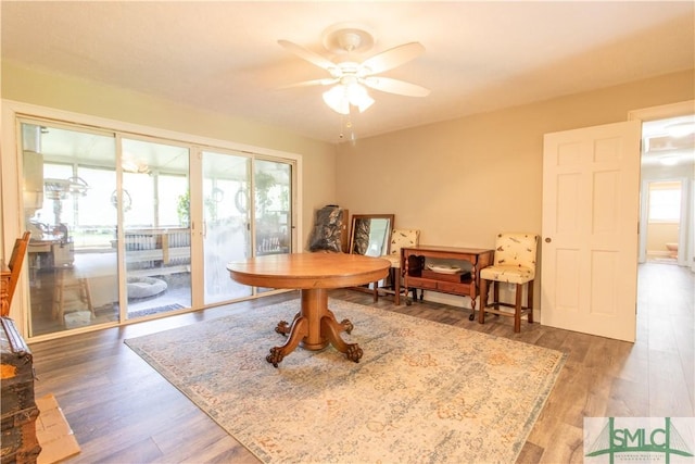 dining room featuring dark hardwood / wood-style floors and ceiling fan