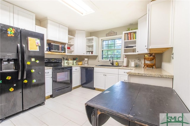 kitchen with white cabinetry, sink, and black appliances