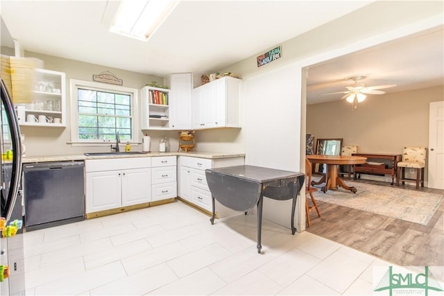 kitchen featuring black dishwasher, sink, white cabinets, and ceiling fan