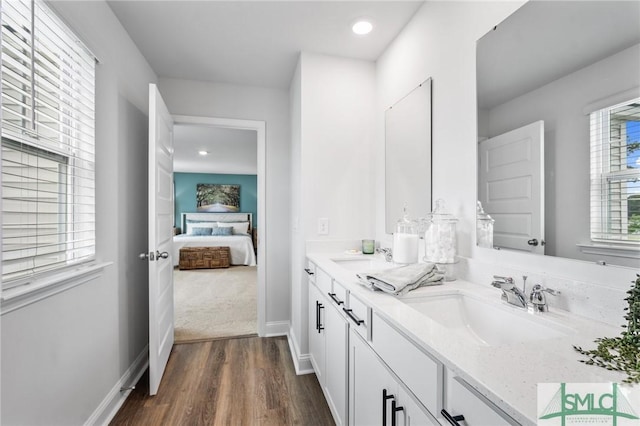 bathroom with vanity and hardwood / wood-style floors