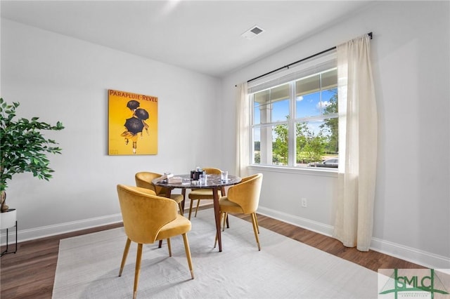 dining area featuring hardwood / wood-style floors