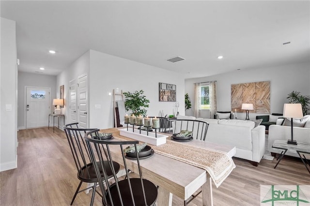 dining area with light hardwood / wood-style floors