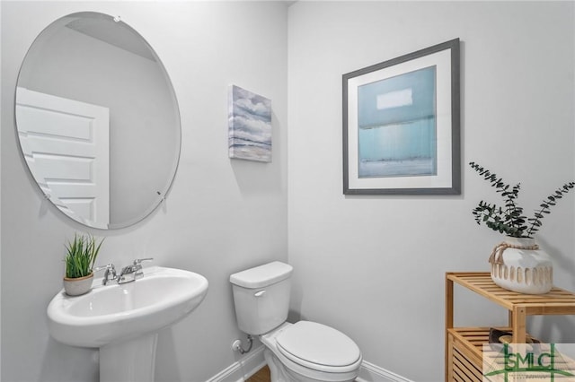 bathroom with sink and toilet