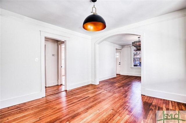 spare room featuring wood-type flooring