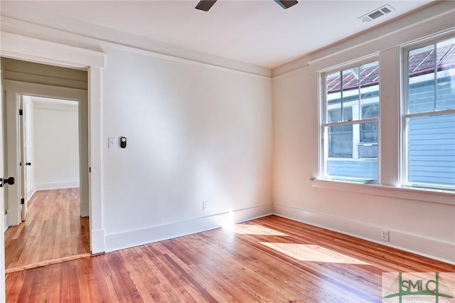 unfurnished room with ceiling fan and light hardwood / wood-style flooring