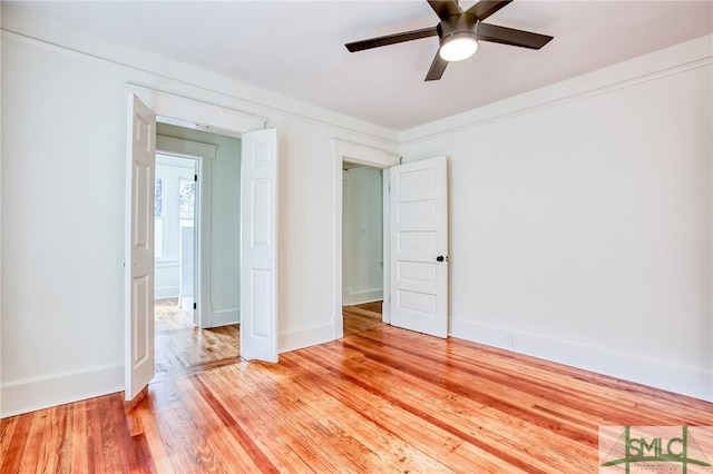 interior space with ornamental molding, light hardwood / wood-style floors, and ceiling fan