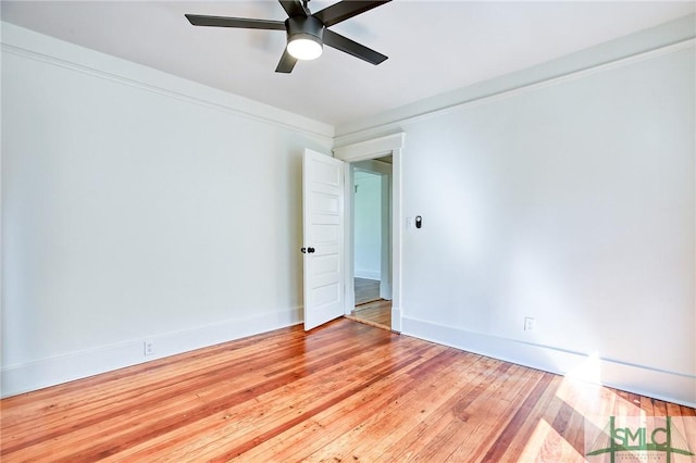 unfurnished room with crown molding, light hardwood / wood-style floors, and ceiling fan