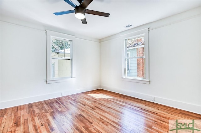 spare room with ceiling fan and light hardwood / wood-style flooring