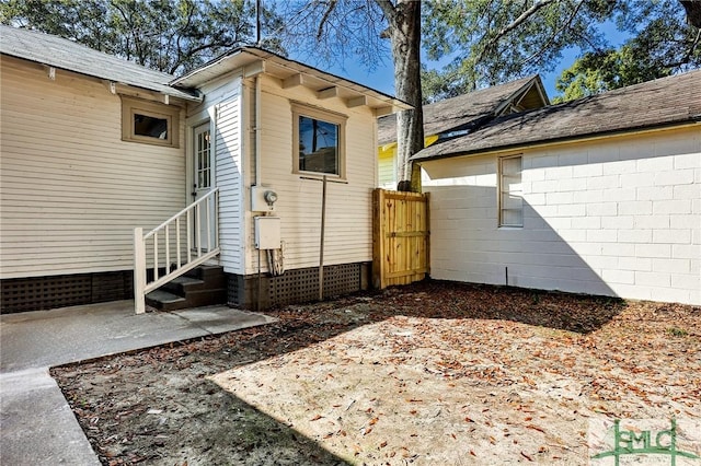 view of side of home featuring a patio