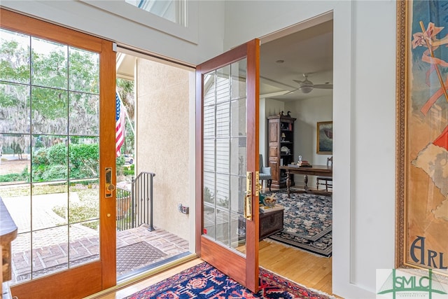 entryway with ceiling fan and hardwood / wood-style floors