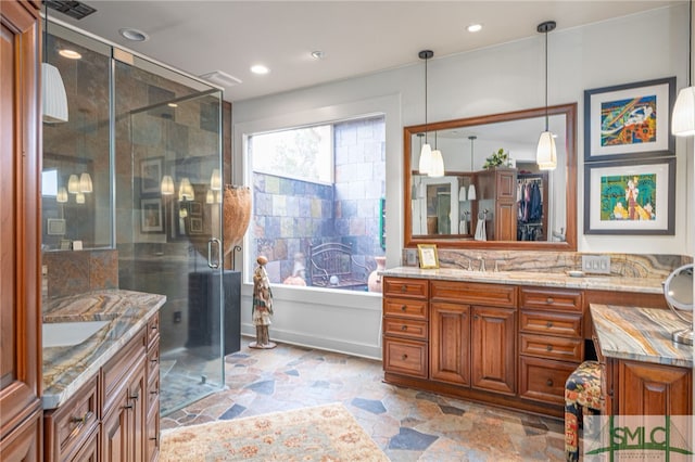 bathroom with shower with separate bathtub and vanity