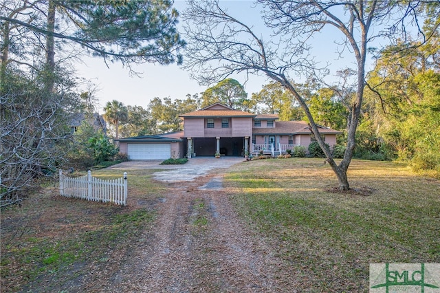 view of front of house featuring a garage and a front yard