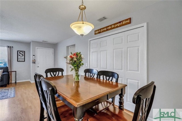 dining space featuring hardwood / wood-style floors