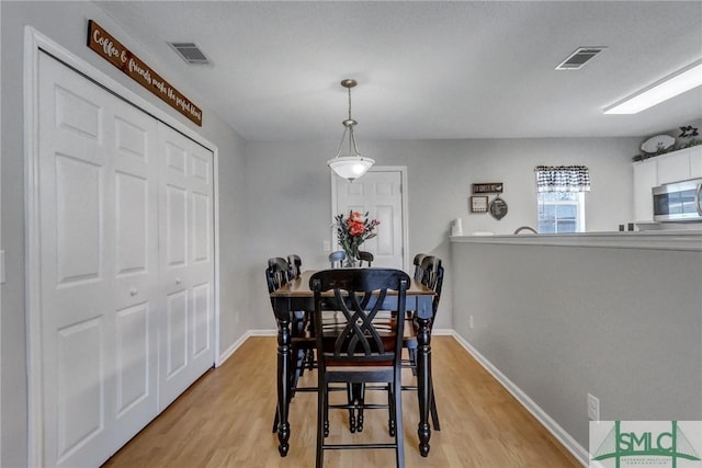 dining room featuring light hardwood / wood-style floors