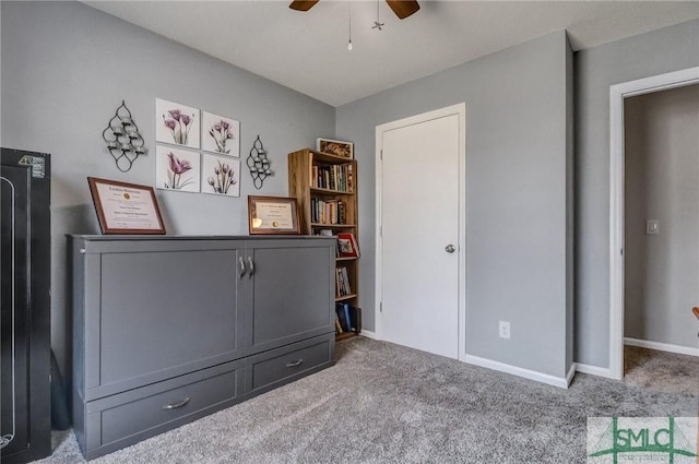 unfurnished bedroom with carpet floors and ceiling fan