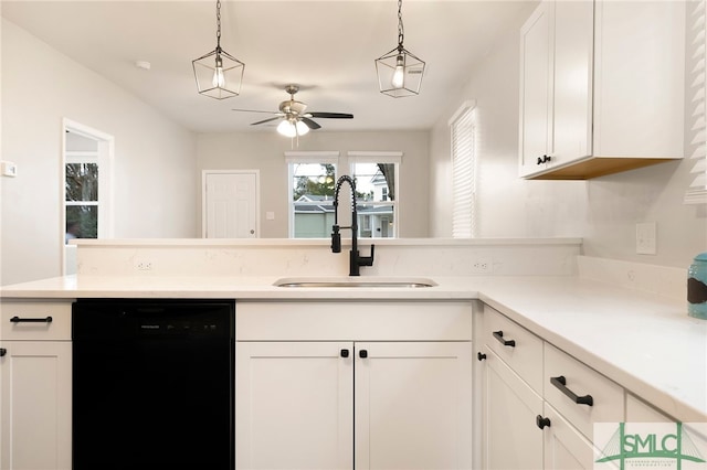 kitchen featuring dishwasher, sink, pendant lighting, and white cabinets