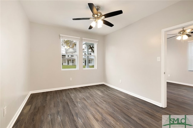 spare room featuring dark hardwood / wood-style floors and ceiling fan