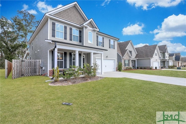 view of front of home with a garage, a front yard, and covered porch