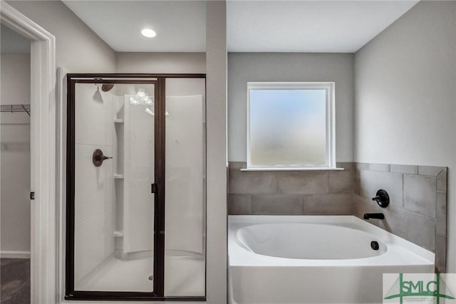 bathroom featuring plus walk in shower