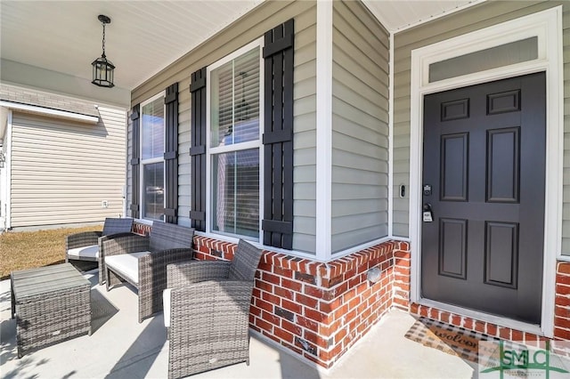 doorway to property featuring covered porch