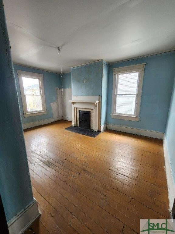 unfurnished living room featuring light hardwood / wood-style floors