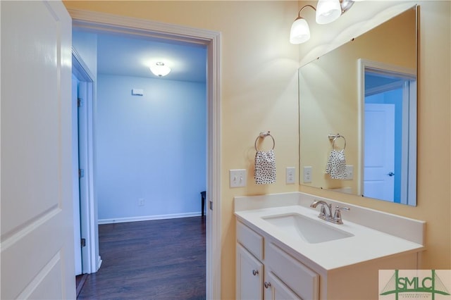 bathroom with vanity and hardwood / wood-style floors