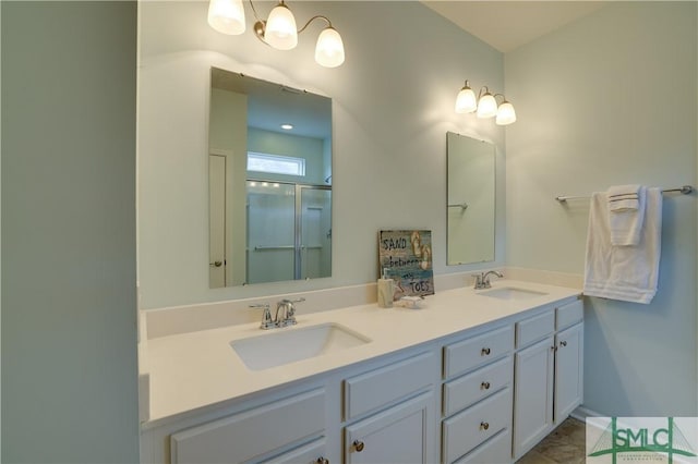 bathroom featuring walk in shower and vanity