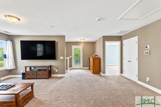 living room featuring light colored carpet