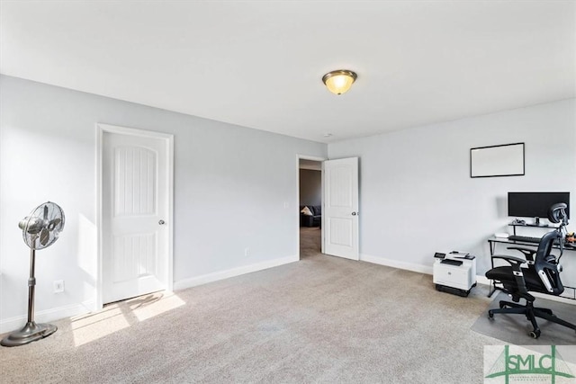 office area featuring light colored carpet