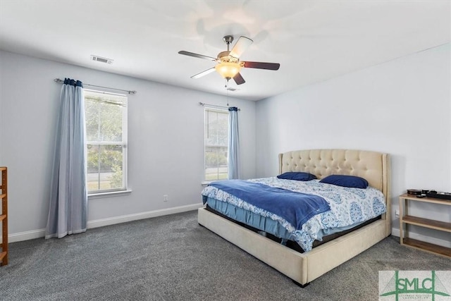 bedroom featuring ceiling fan and carpet