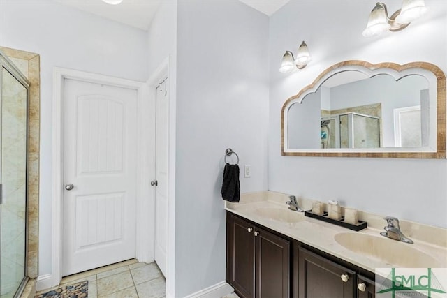 bathroom with vanity, an enclosed shower, and tile patterned flooring