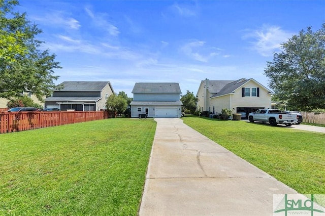 view of front of home featuring a garage and a front lawn