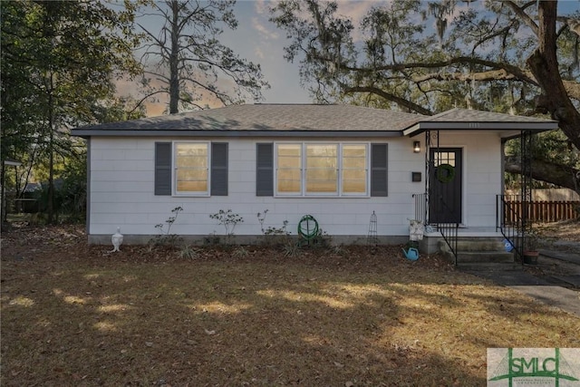 view of front of house with a yard