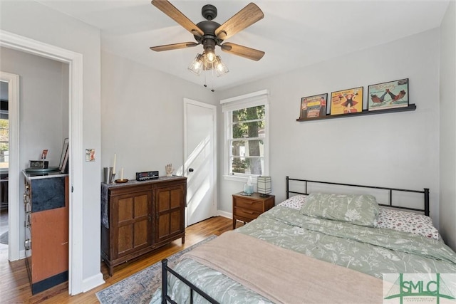 bedroom featuring wood-type flooring and ceiling fan