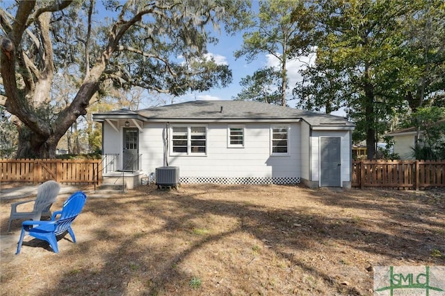 back of property featuring central AC unit